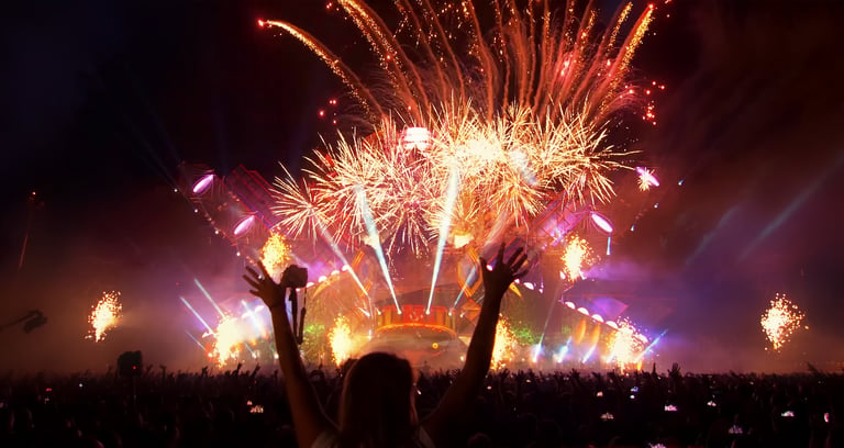 Festival crowd with fireworks and stage lights