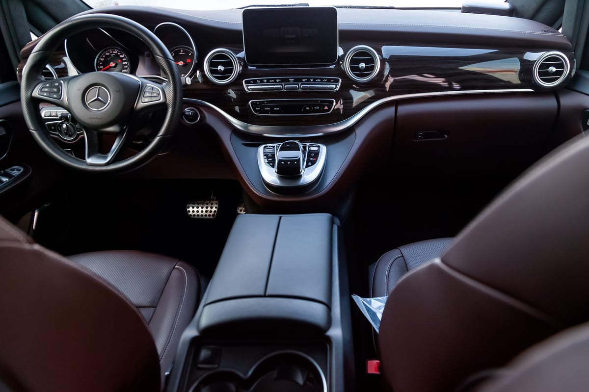 Interior of Mercedes-Benz V-Class luxury business van with perforated leather seats