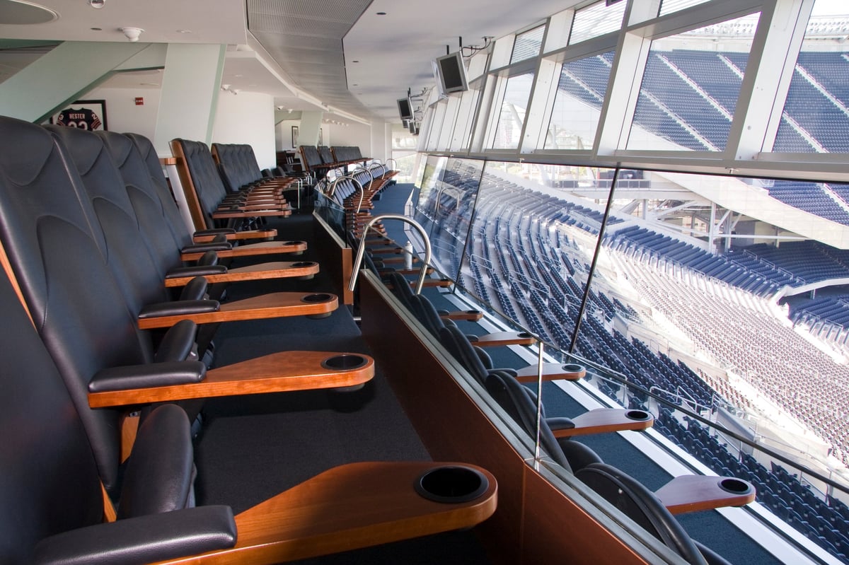 Empty luxury stadium suite with plush seats