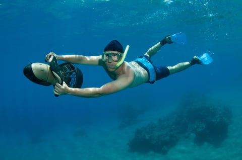 Snorkeler in crystal blue water