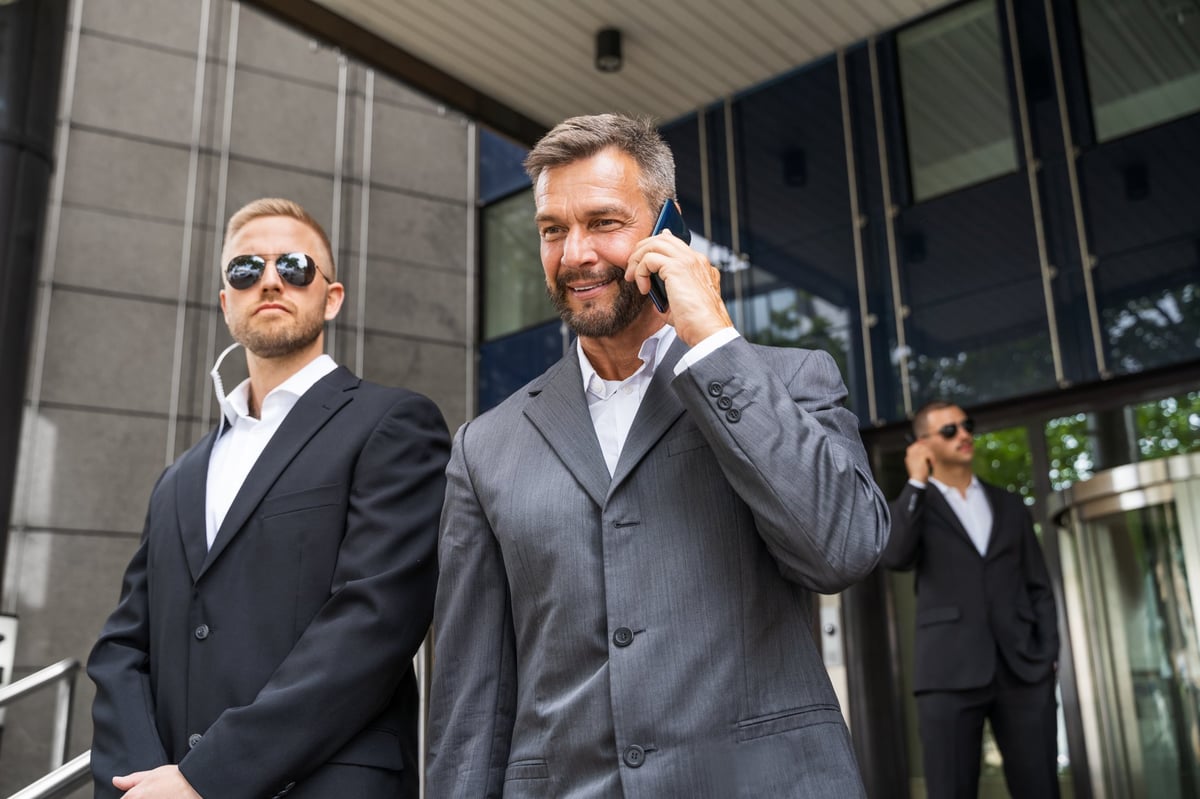 Security Guard Service Protecting Business Man Outside