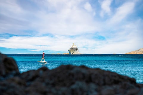 Electric hydrofoil near luxury yacht Sardinia