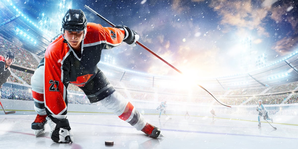 Professional hockey player ready to attack in ice arena