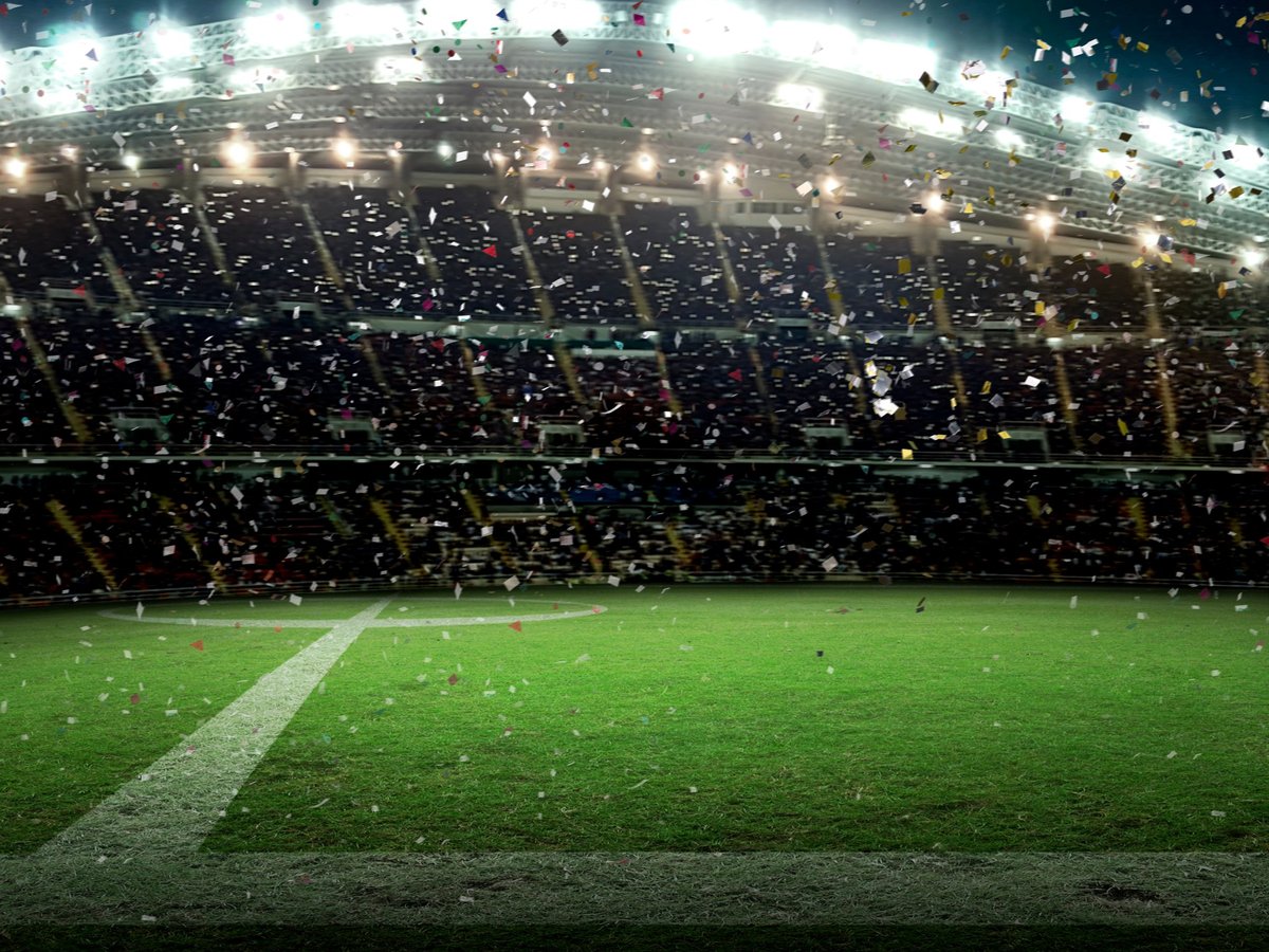 Stadium with fans at night celebrating the championship