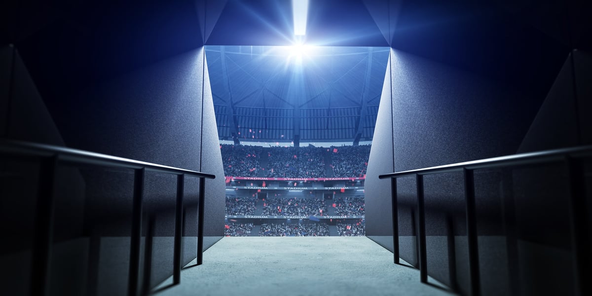 The entrance for players in the stadium with dramatic arena lighting