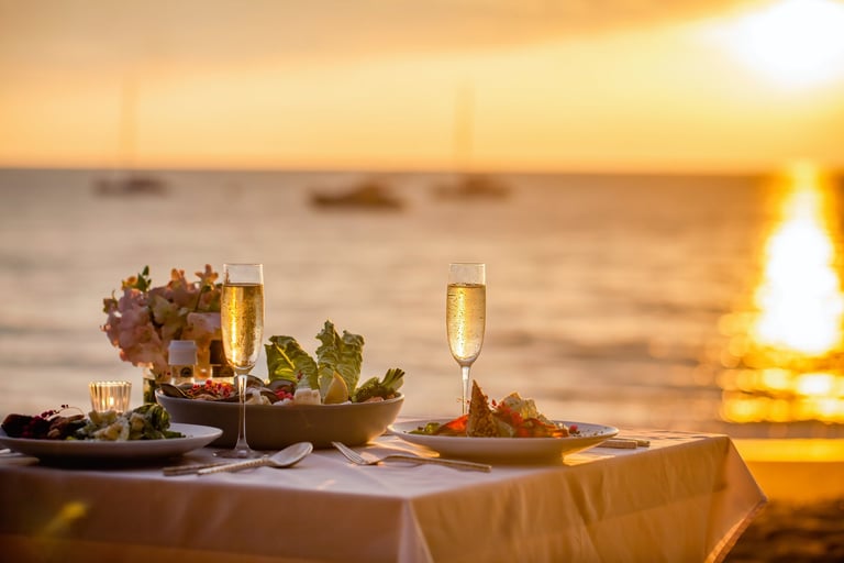Romantic sunset dinner on the beach with luxury table setting