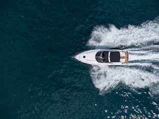 Speed motor boat on open blue sea