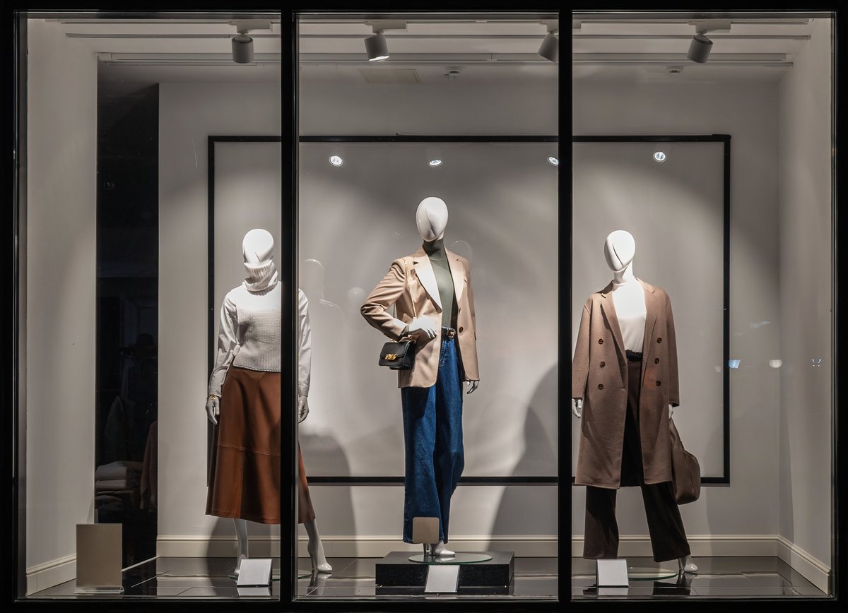 Shop windows and mannequins Fashion Store exterior City Night Boutique