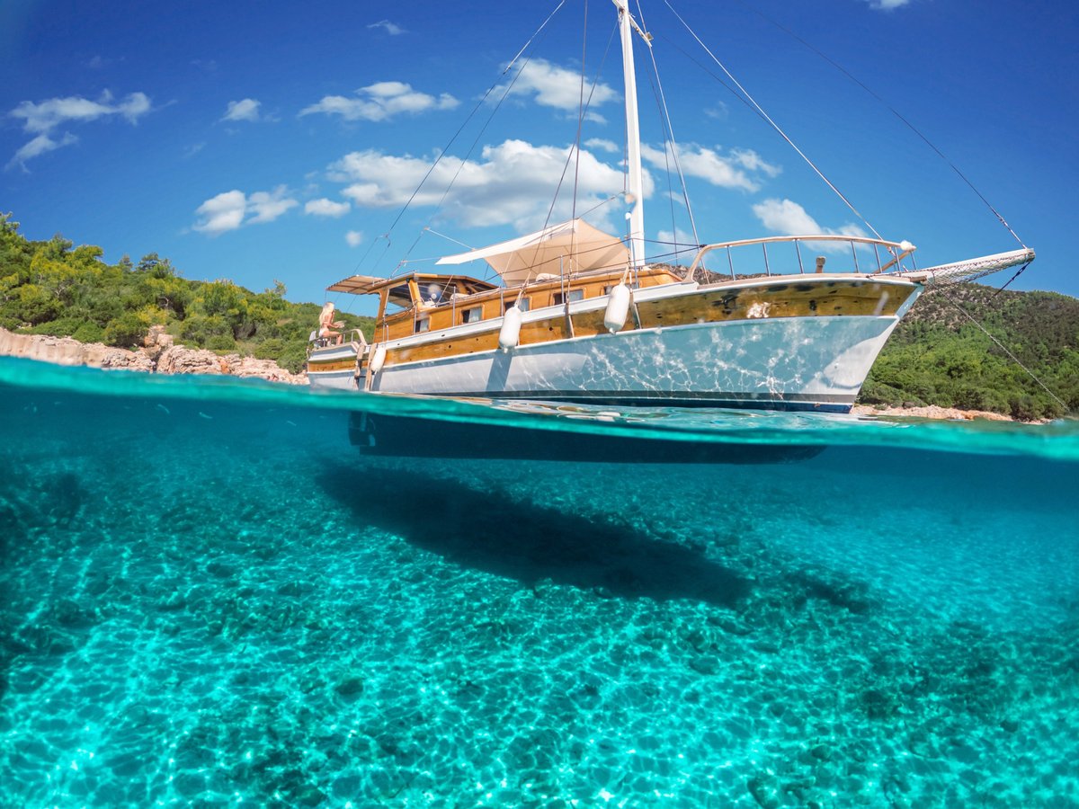 Split view - half underwater view of beautiful seabed and marine yacht, Turkey, Bodrum