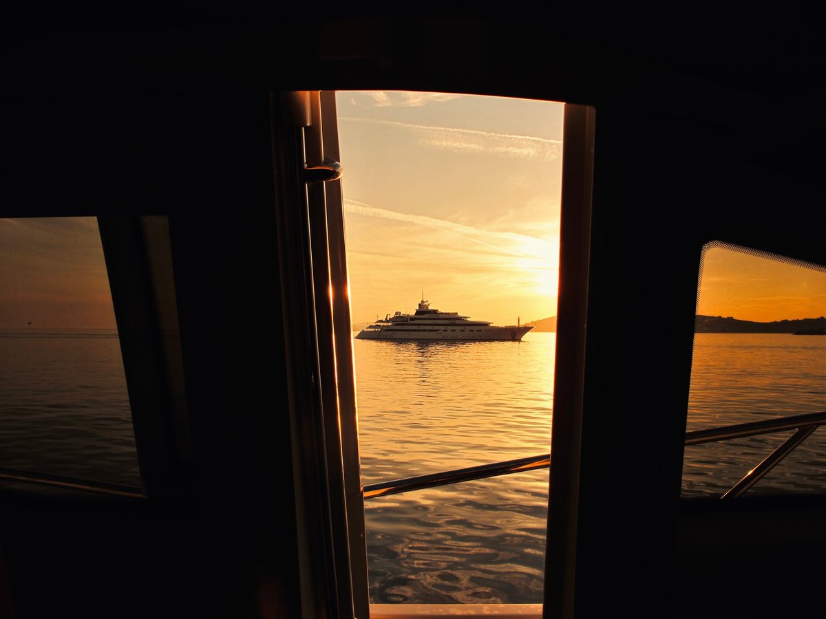 Luxury yacht at sea during golden sunset on the Turkish Riviera