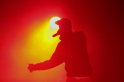 Hip hop artist performing on concert stage