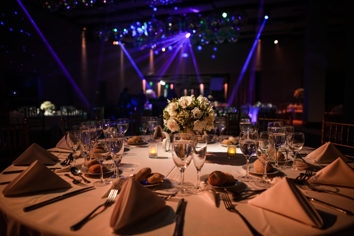 Decorated table with zenithal illumination and blurred background of lights