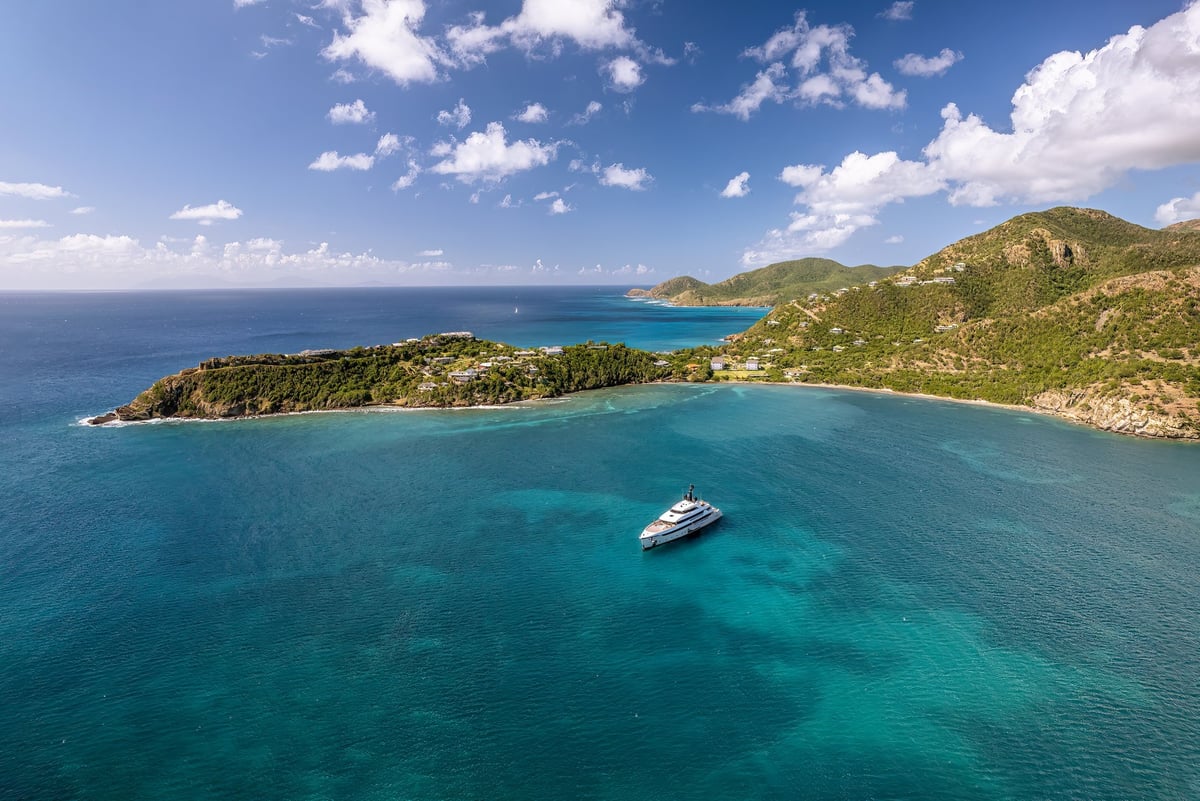 The drone aerial view of Deep Bay beach in Antigua Island