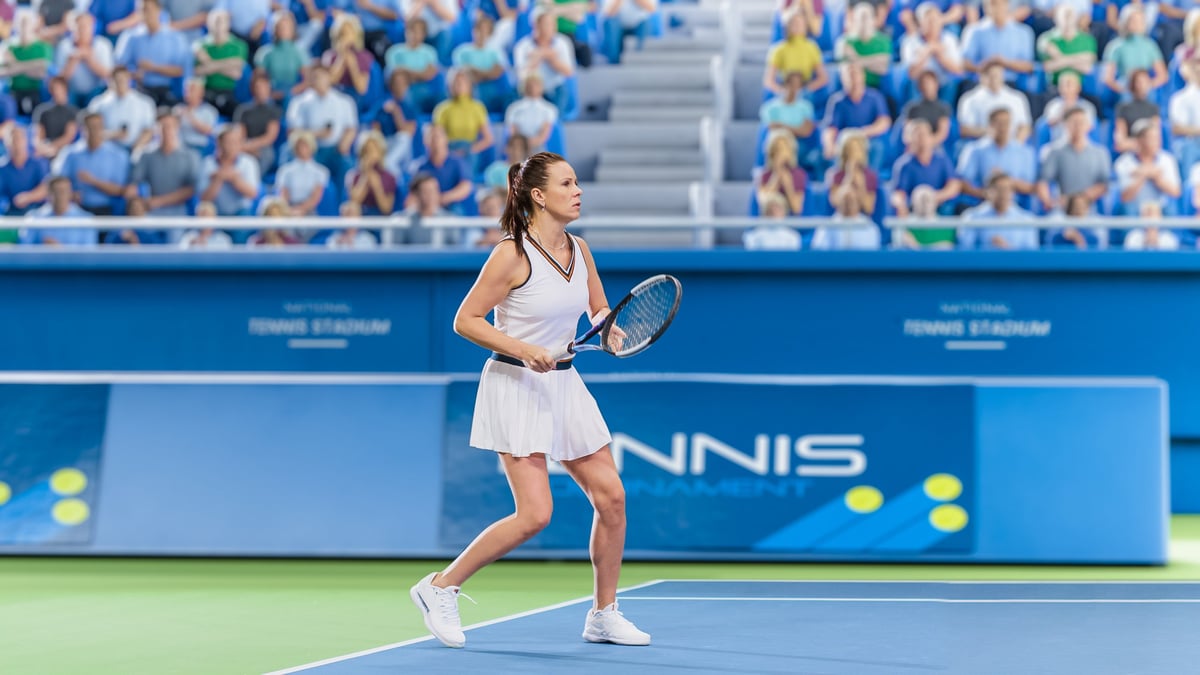 Female tennis player hitting ball during championship match with excited crowd cheering