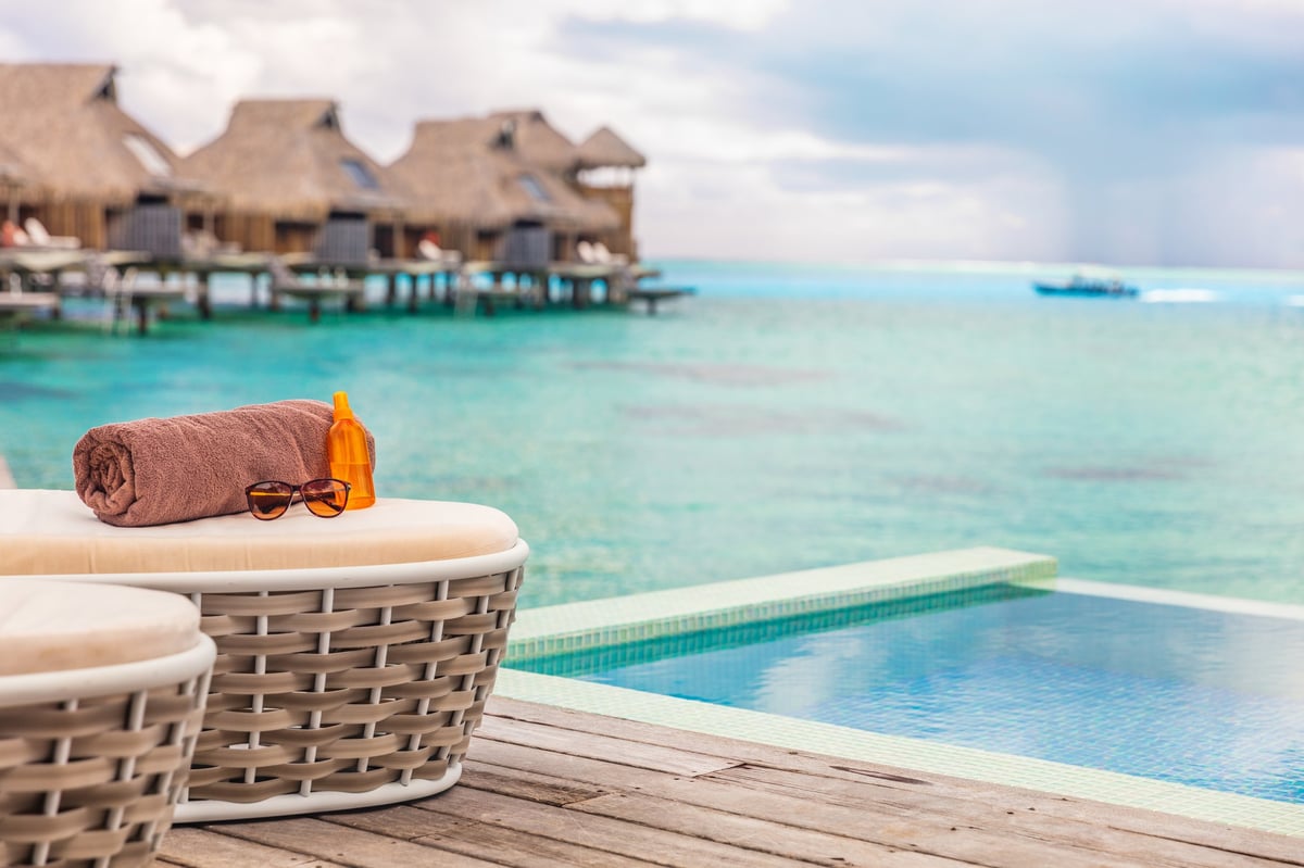 Luxury Bora Bora overwater bungalow villas high end hotel in Tahiti, French Polynesia. Ocean view summer travel destination resort