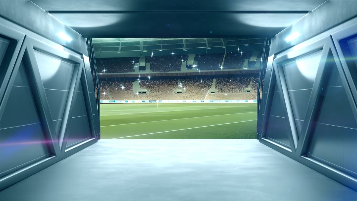 Sports stadium interior with dramatic lighting and premium seating