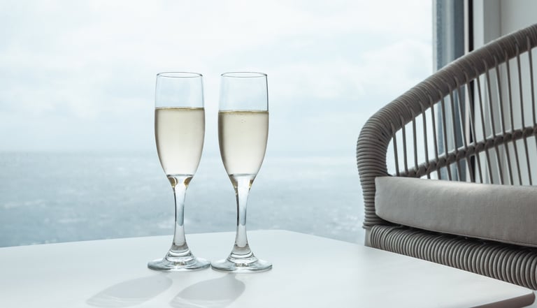 Luxury cruise ship suite interior with champagne on balcony