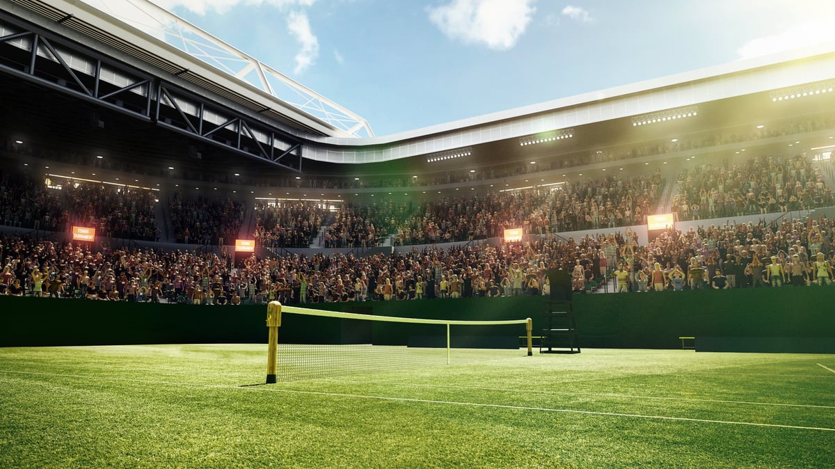 Empty tennis court with grass surface and crowd in stadium stands waiting for match