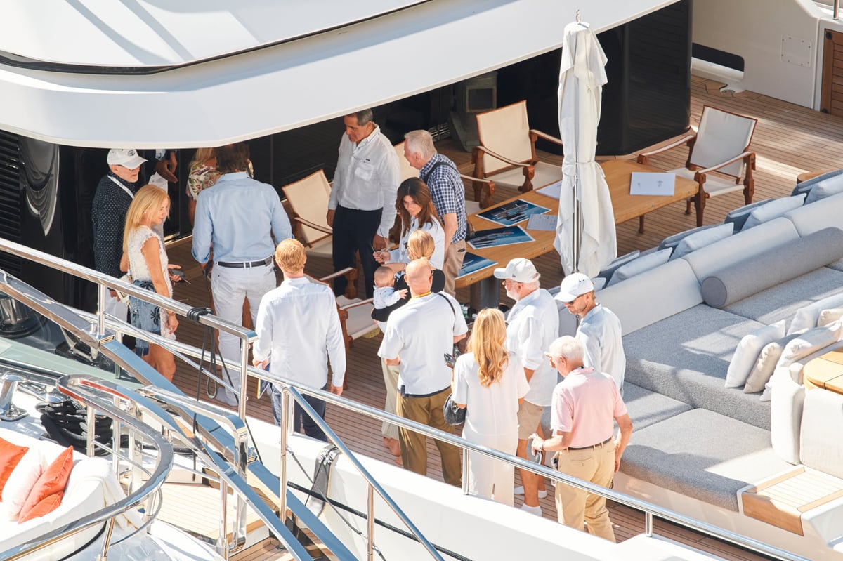 Monaco yacht show - wealthy clients inspecting megayachts at Port Hercules