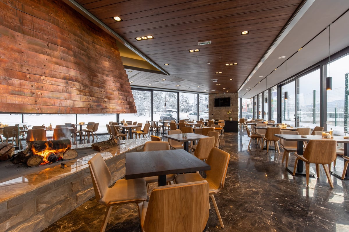 Luxury Swiss fine dining restaurant interior with elegant mountain ambiance