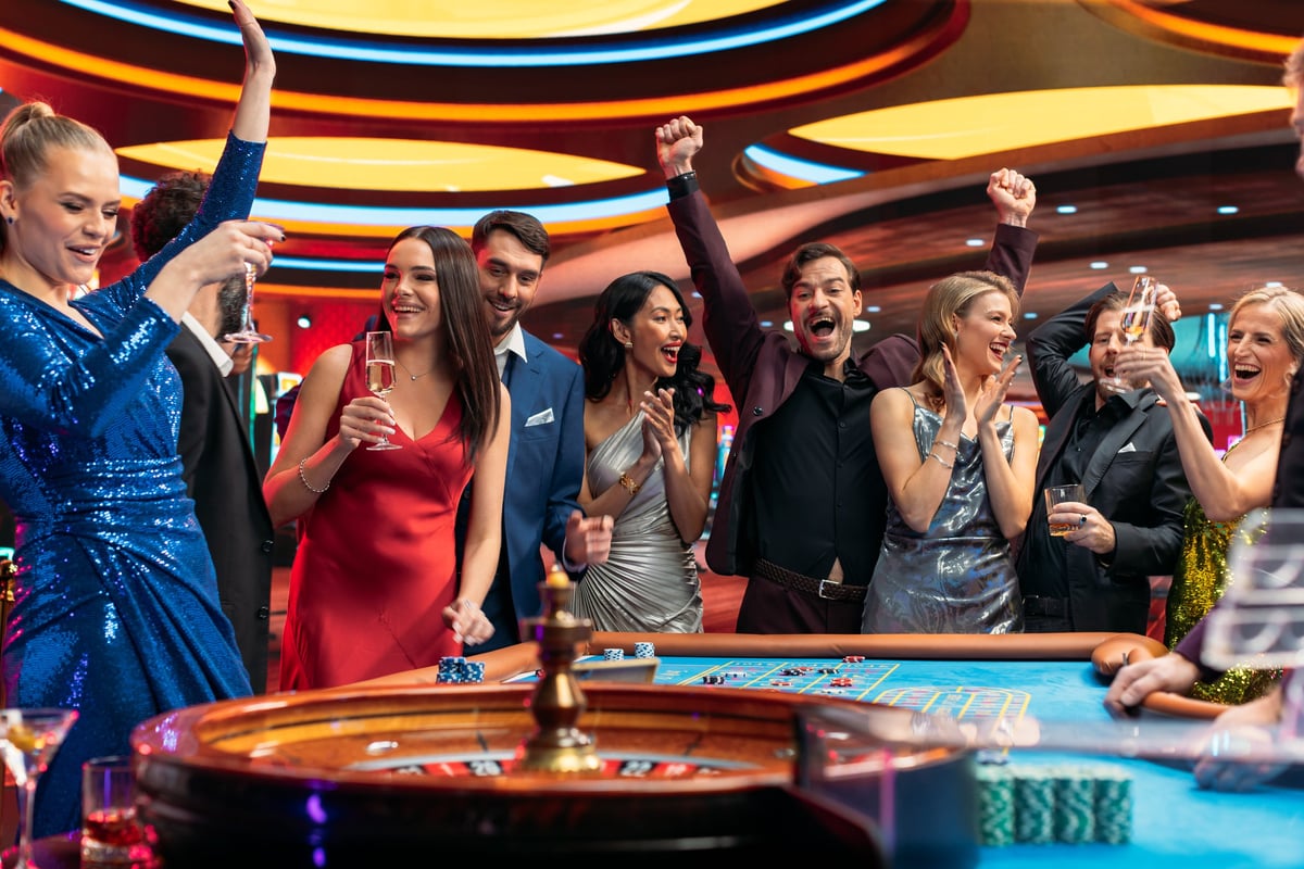 Group of Diverse Young People Gambling at a Casino playing roulette