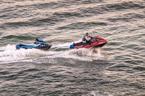 Jet Ski returning to port sunset