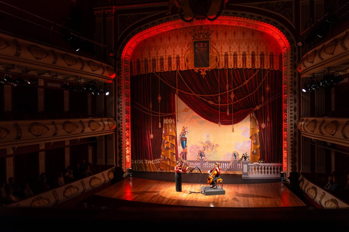Spectacular live classical music concert on stage with dramatic lighting
