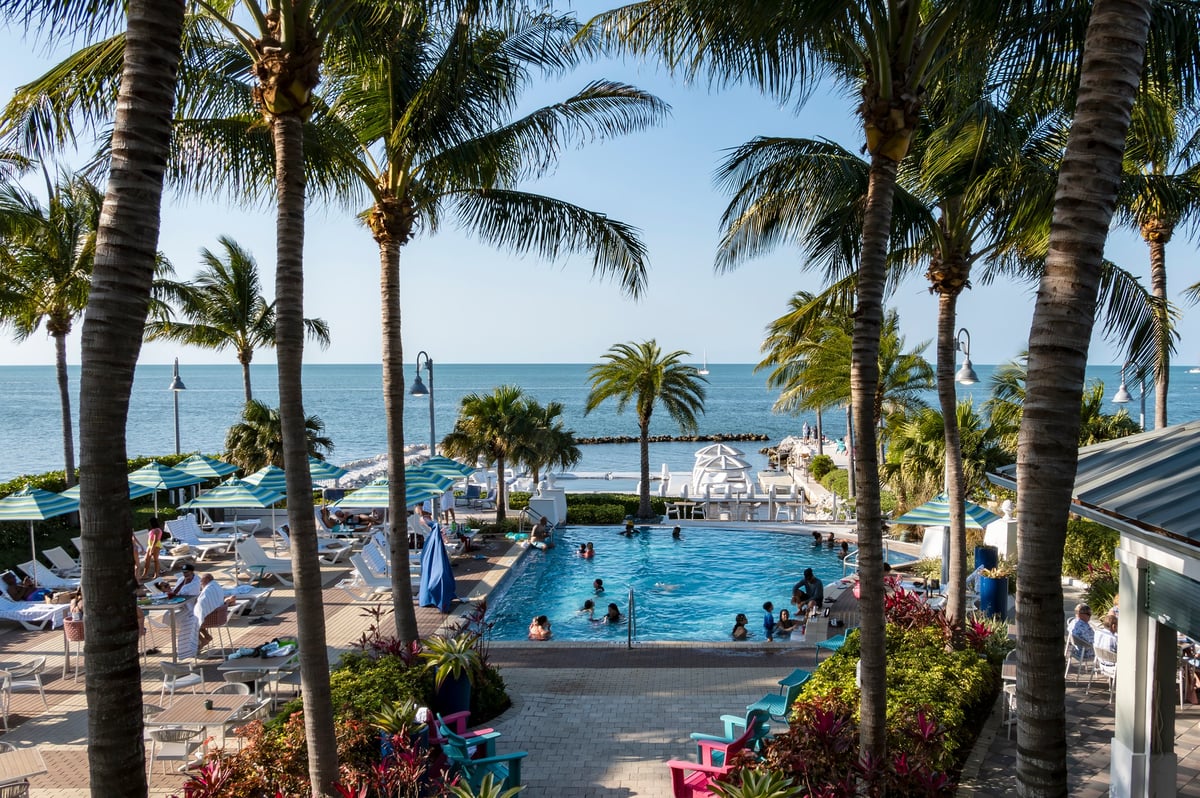 Luxury oceanfront beach club with pool and cabanas in Cancun Mexico