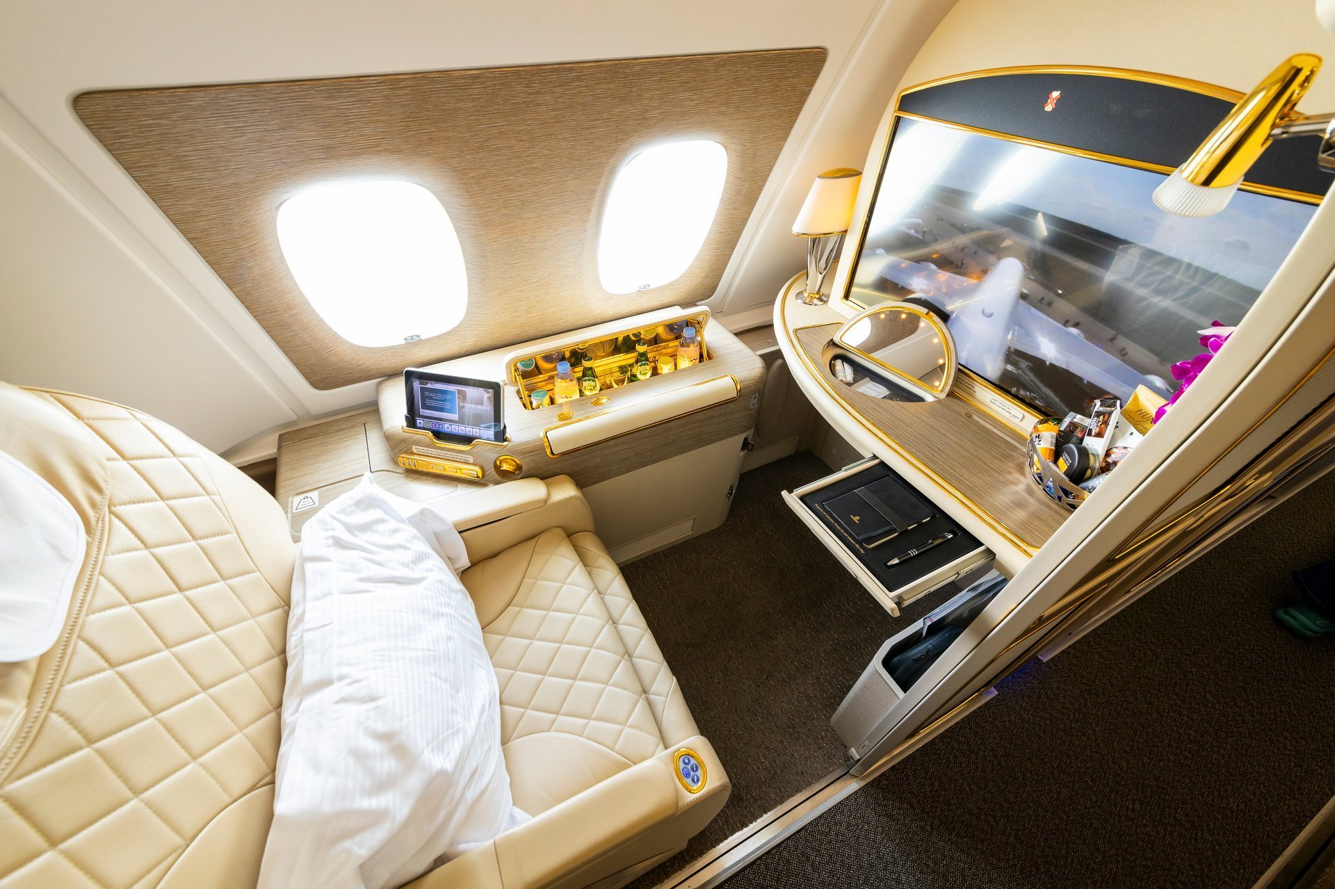 First Class window seat in Airbus A380 upper deck with luxurious travel style