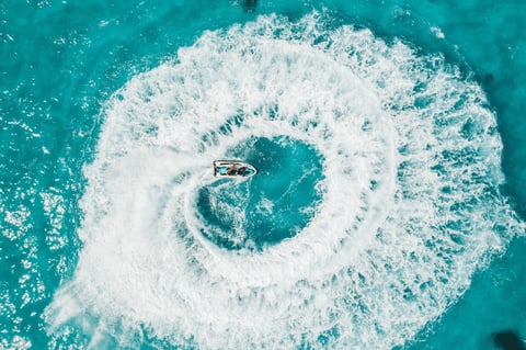 Aerial view person riding jet ski