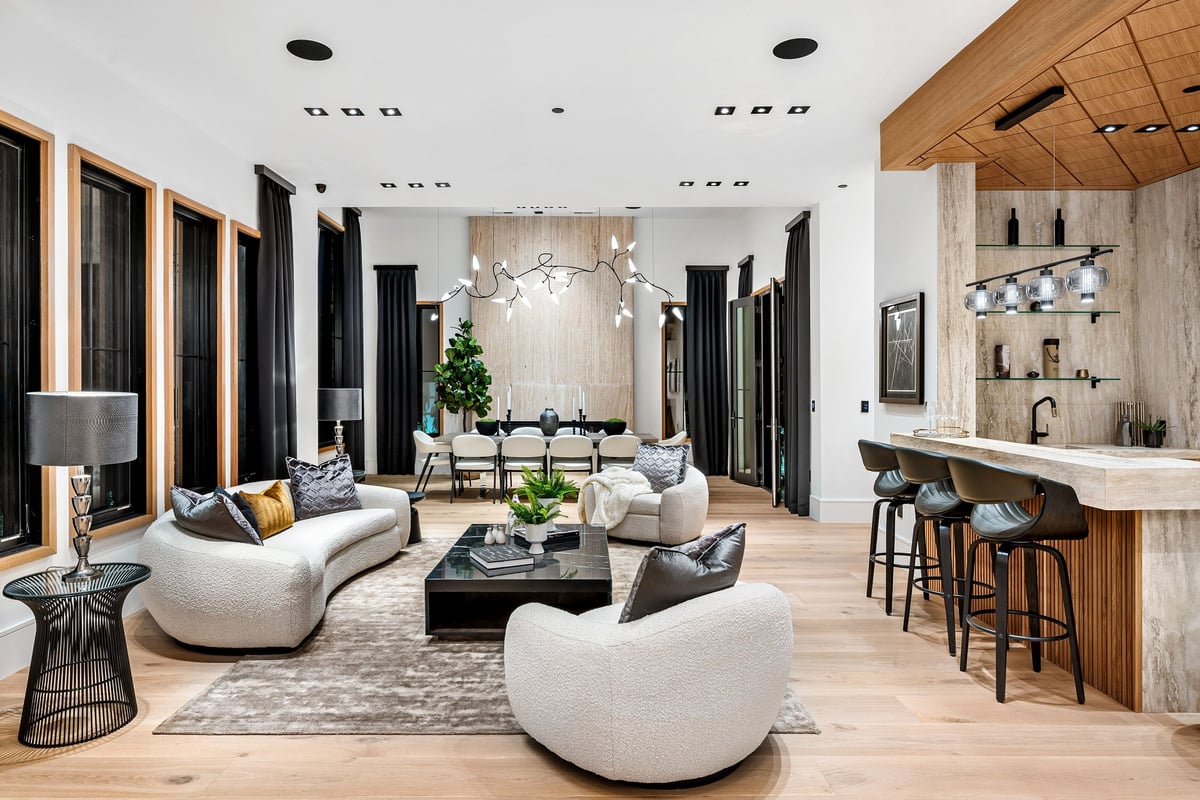Modern luxury living room with contemporary furniture, bar area, and stylish decor