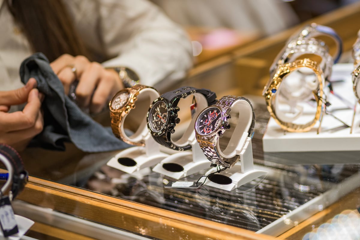 Close-up of elegant wristwatches on display in a jewelry store, showcasing luxury and style