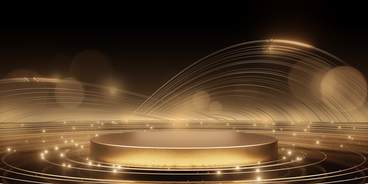 Luxurious golden podium surrounded by glowing circular light waves at upscale awards ceremony