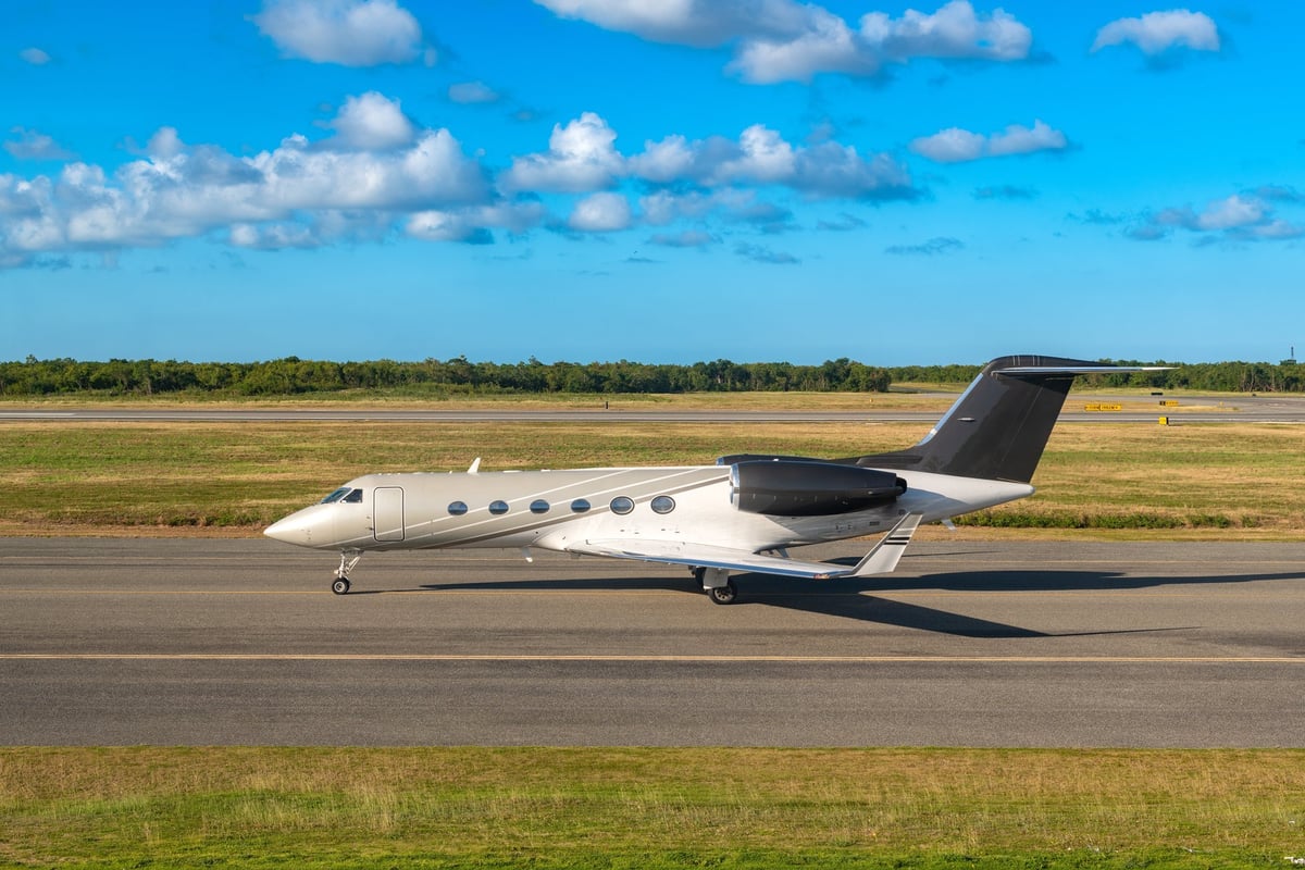 A sleek private jet is taxiing on the runway of Punta Cana airport