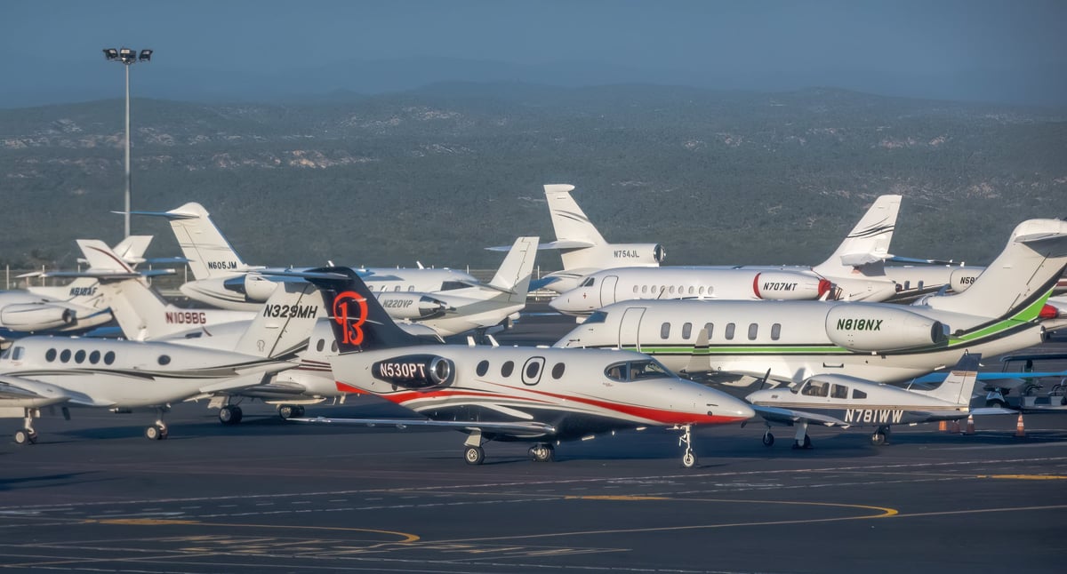 A Learjet 45 private jet parked on the tarmac at an airport in Los Cabos