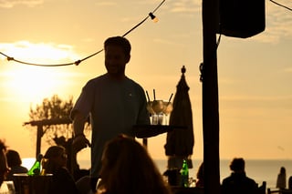 Beachfront hot spot with large terrace at sunset