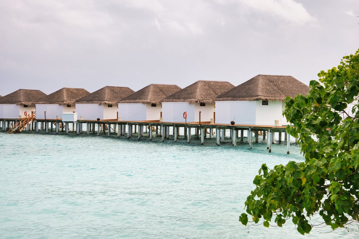 Overwater villas on crystal clear waters in the Maldives