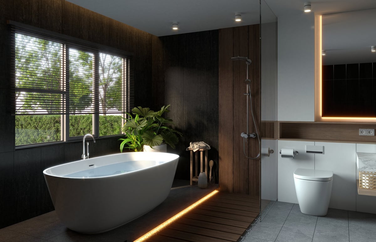 A modern bathroom with a freestanding tub, natural light
