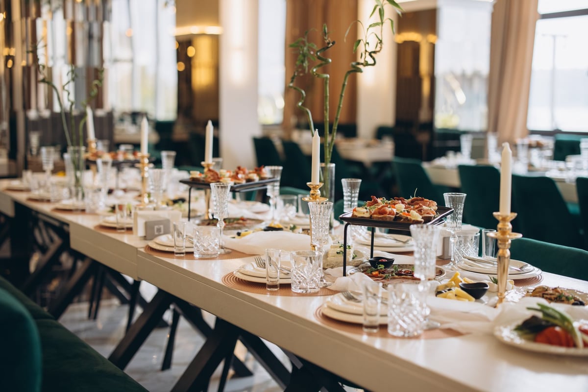 Luxurious fine dining table with candles and crystal glasses overlooking the Caribbean in Cancun