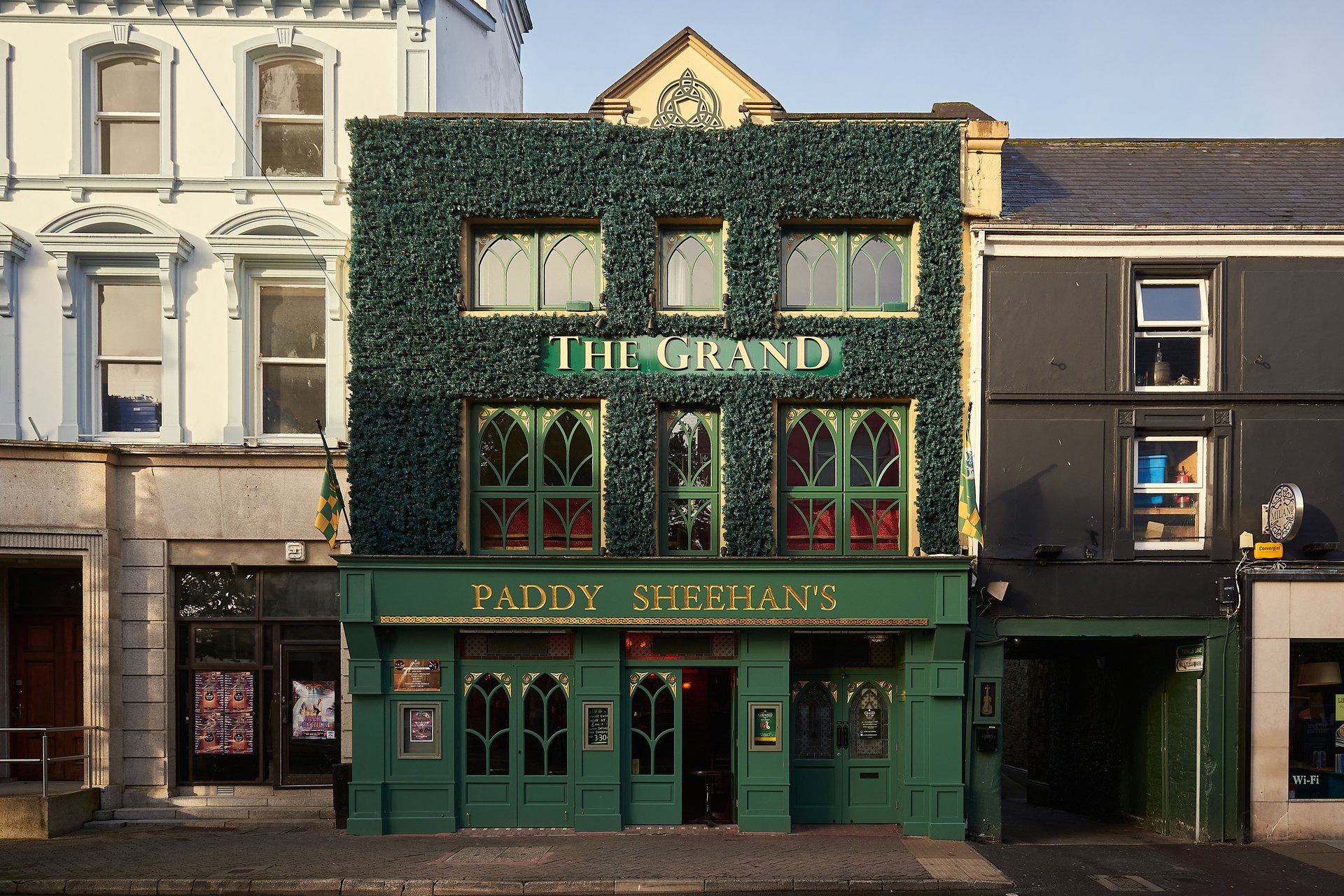 Killarney Ireland pub with green ivy-covered facade and classic Irish pub aesthetics