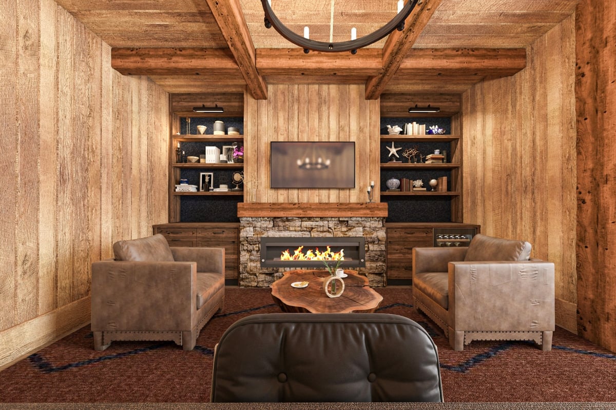 Luxury ski chalet interior with stone fireplace and cozy leather chairs
