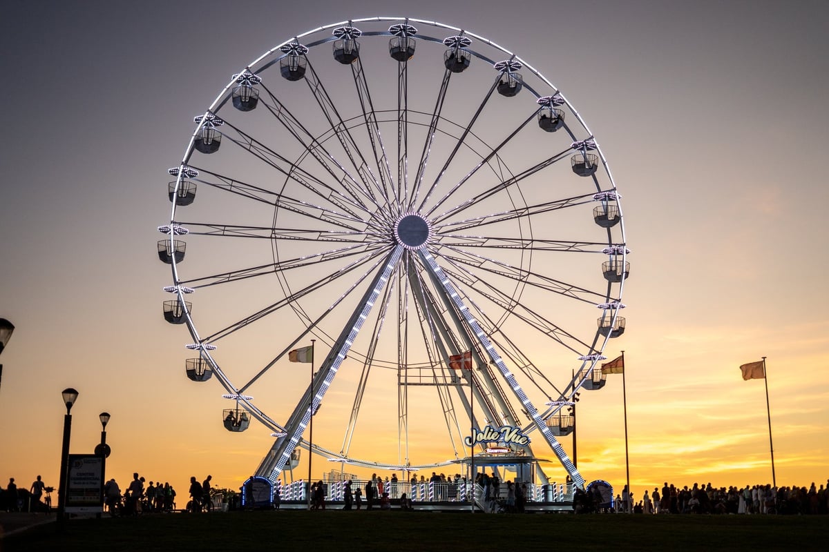 Ferris wheel at sunset festival atmosphere