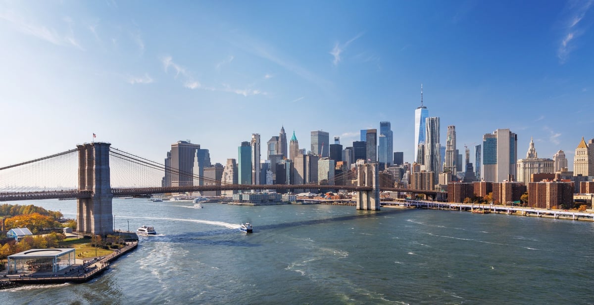 Iconic urban skyline view with historic bridge and skyscrapers