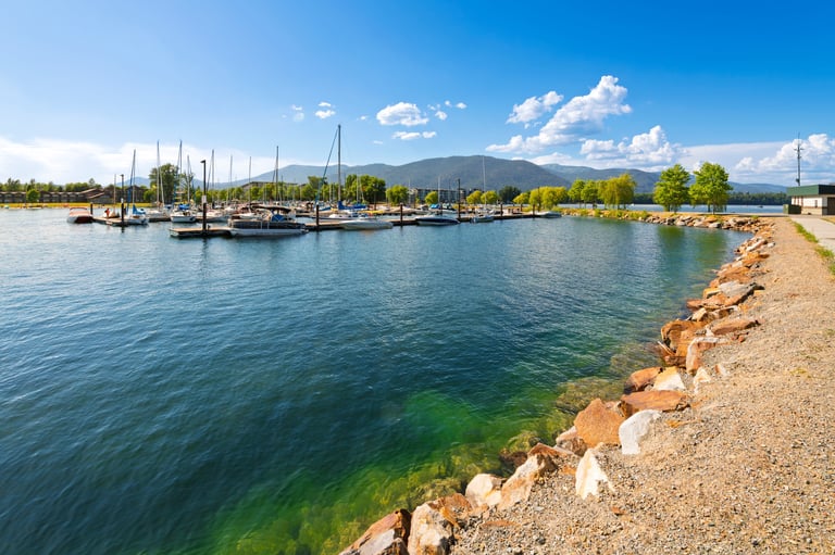 The marina in the downtown lakefront district of the small town of Sandpoint with boats filling the docks