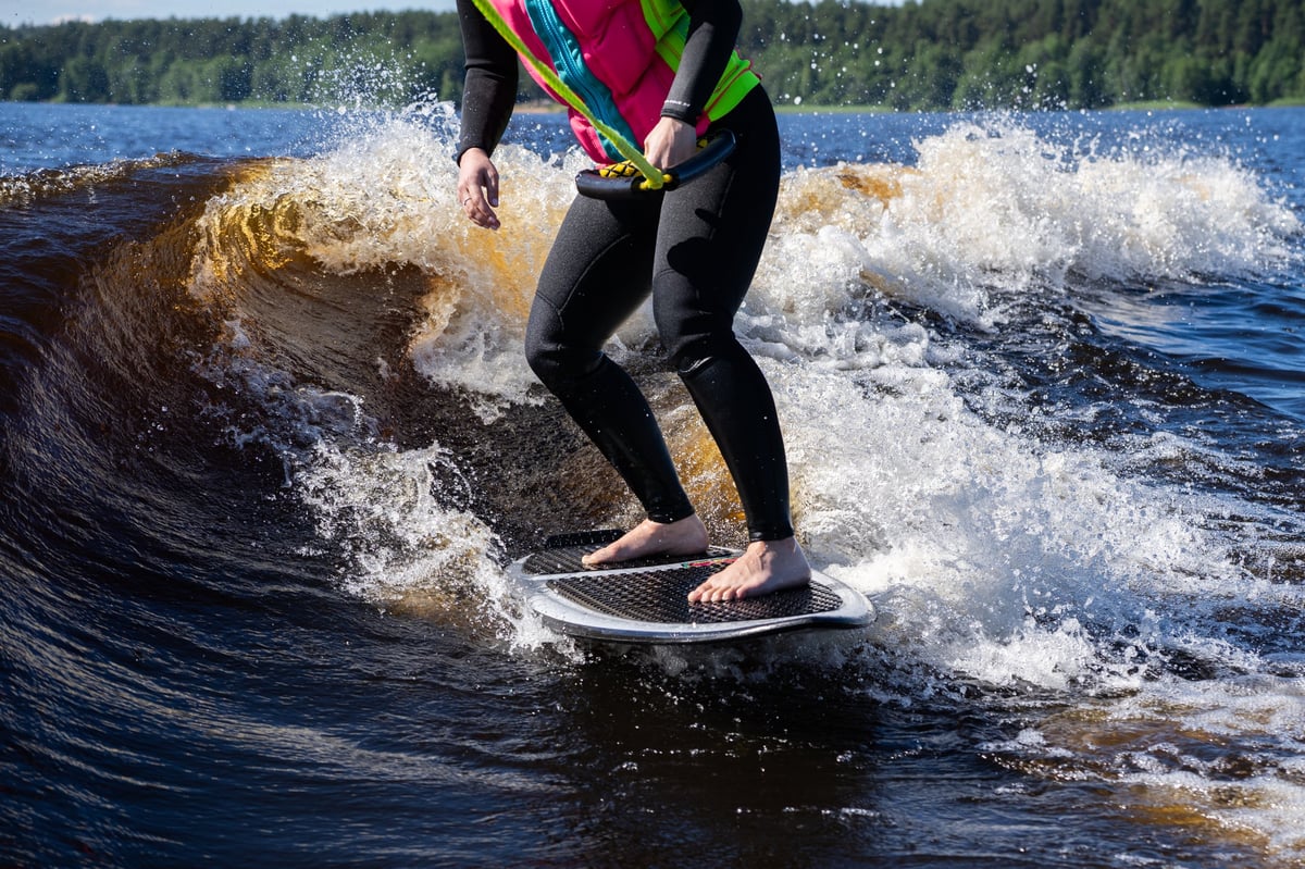 Wake surfing summer lake