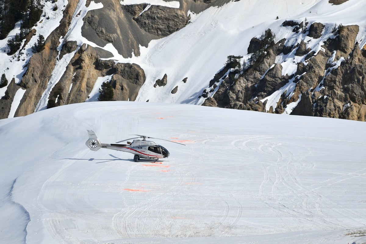 Parked helicopter on Courchevel airport by winter