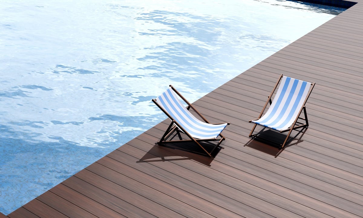 Luxury pool deck with lounge chairs at a beach club on the French Riviera