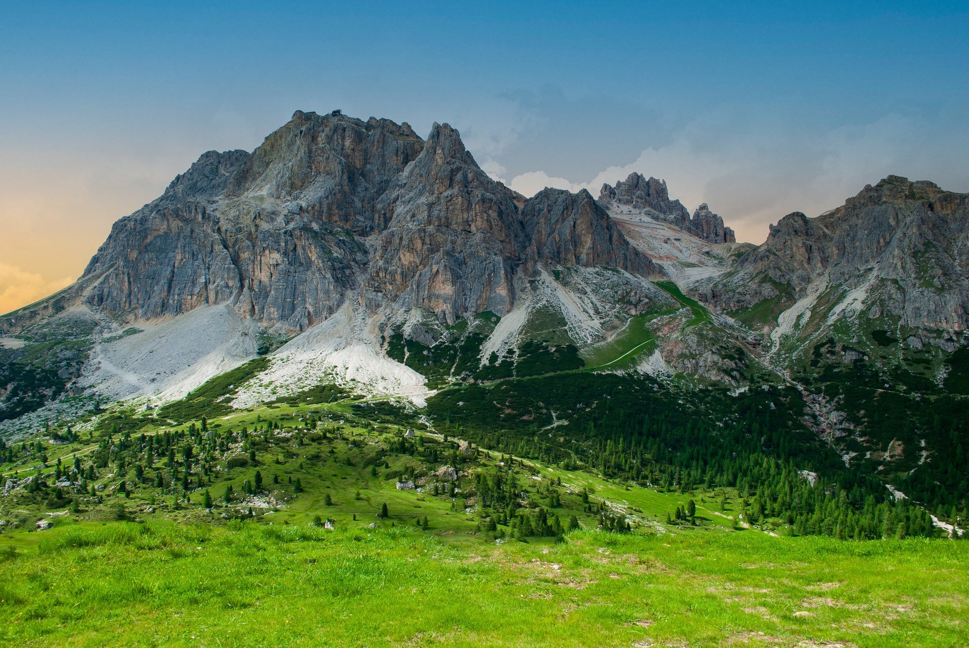 Courchevel French Alps summer landscape with green alpine meadows and mountain peaks