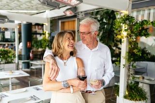 Senior couple enjoying wine at outdoor restaurant