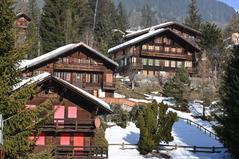 Luxury mountain chalets in snowy winter landscape